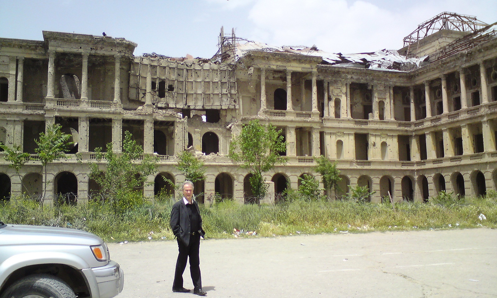 Reiner Braun of International Association of Lawyers Against Nuclear Arms outside the bombed-out Darul Aman Palace on the outskirts of Kabul