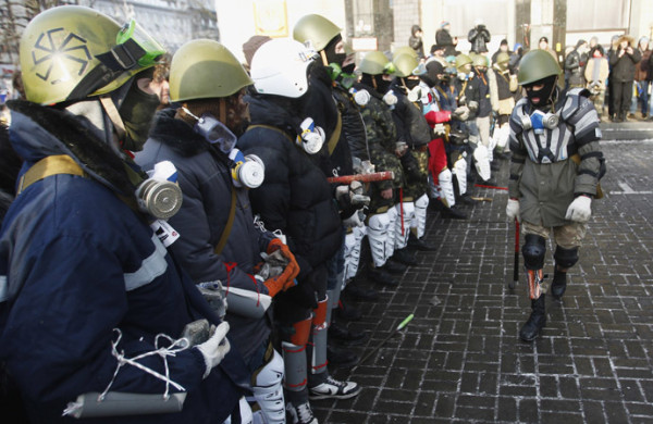 Anti-government protesters from far-right group "Right Sector" train in Independence Square in central Kiev