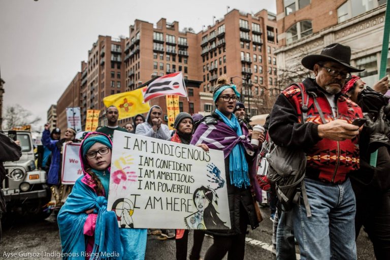 Activists and Native Americans march on Washington amid rain, sleet and