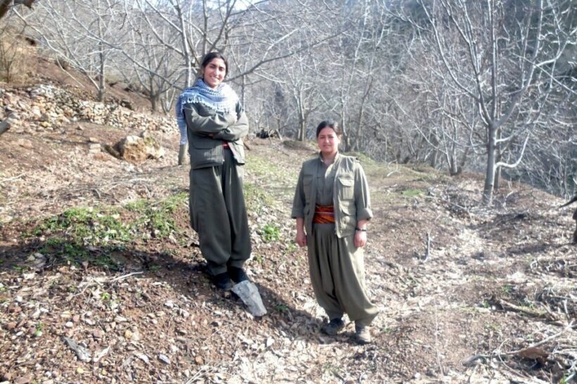 PJAK copresident Zilan Vejin and a fellow fighter somewhere in the Kurdish mountains.