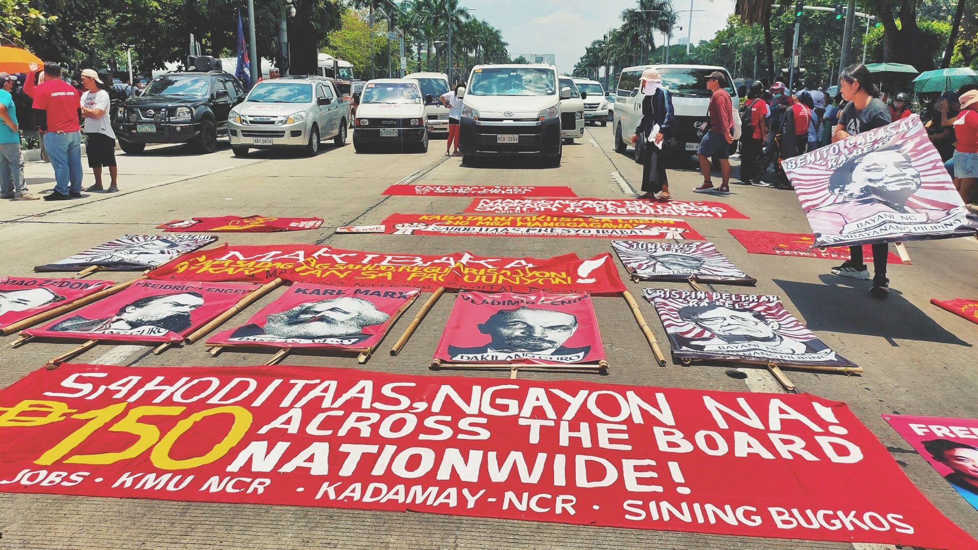 Meanwhile, upon arrival in front of the US Embassy, protest groups lay down their flags, placards, and posters on the road to highlight their cause.