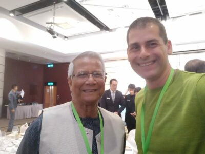 Muhammad Yunus (Bangladeshi social entrepreneur & Nobel Peace Prize winner), left, is with Ami Dror (Founder of Leap Learner), right. Two leading social entrepreneurs in this photo. Source: Wikimedia Commons.