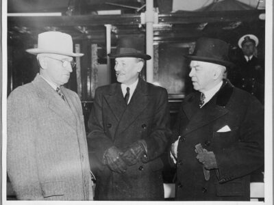 Photo shown in the exhibition from Library and Archives Canada of President Harry Truman, British Prime Minister Clement Attlee, and Canadian Prime Minister Mackenzie King meeting in Washington in November of 1945 to discuss who would control the atom bomb.