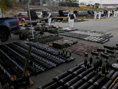 Kosovo police officers display weapons and military equipments seized in the village of Banjska, in Mitrovica, Kosovo, September 25, 2023.