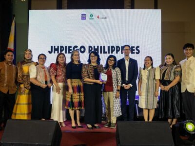 Dr. Ingrid Magnata, Country Program Manager of Jhpiego Philippines, receives a plaque during the SHE Project closeout, recognizing Jhpiego’s commitment to advancing SRHR and preventing GBV.