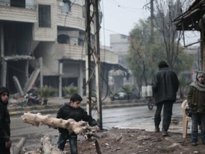 Boys collect firewood in Kafar Batna village in Rural Damascus, Syria.