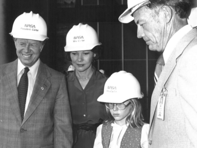 President Carter, wife Rosalynn and daughter Amy are shown a scale model of the crawler that transported the total shuttle launch configuration to Pad 39 from the Vehicle Assembly Building by NASA’s Kennedy Space Center Director Lee Scherer in 1978..