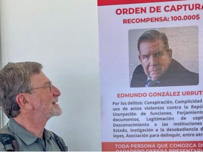 Author views wanted poster for González at the Caracas airport.