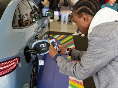 (240831) -- JOHANNESBURG, Aug. 31, 2024 (Xinhua) -- A visitor takes photos of an electric vehicle of BYD from China during the Festival of Motoring in Johannesburg, South Africa, Aug. 30, 2024. This event is held here from Aug. 30 to Sept. 1. (Xinhua/Zhang Yudong)