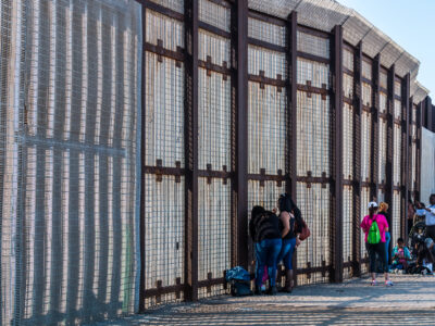 Friendship Park international border wall separating San Diego from Tijuana, where people gather to communicate with loved ones through the fence.