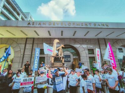 NGO Forum Protest at ADB HQ. Climate advocates held a creative protest outside the Asian Development Bank HQ in Mandaluyong City on June 3, 2025, coinciding with the Asian Clean Energy Forum’s 20th anniversary. The action featured a live skit, symbolic race, and “Trophy of Shame” to highlight ADB’s alleged failure to meet the Paris Agreement’s 1.5°C goal. (Karl Isaac Santos)