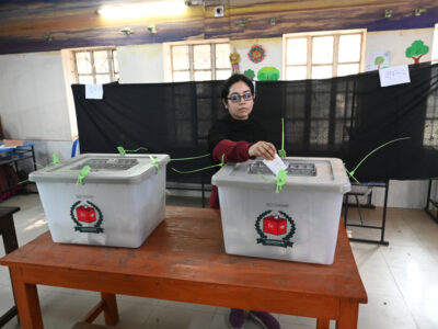 A woman casts her ballot to vote at a polling station during Bangladesh's general elections in Dhaka, Bangladesh, on January 7, 2024