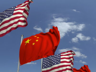 Flags of China and the USA at international meeting, 3D rendering